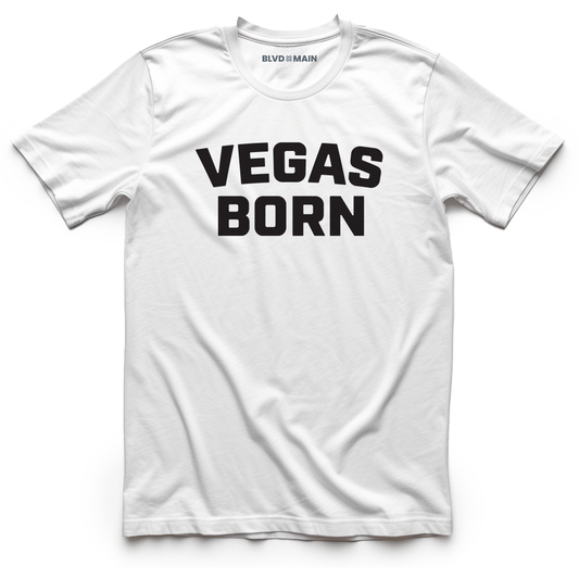 A white crew neck t-shirt with 'VEGAS BORN' printed in black text across the chest.