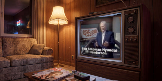 Ben Stepman Hyundai Henderson commercial playing on a 1990s console TV in a wood-paneled living room