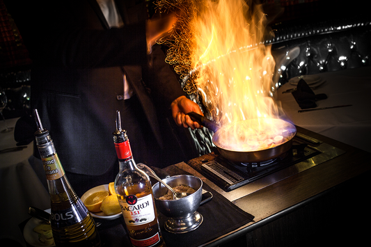 Tableside flambé service at the Golden Steer Steakhouse, Las Vegas — the supper-club tradition that defines old Vegas